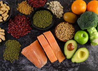 a variety of fruits and vegetables are arranged on a table