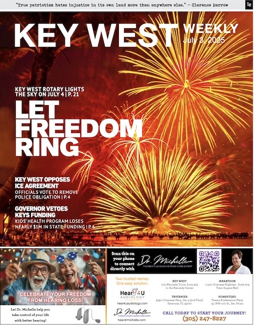 the front page of a news paper with fireworks in the background
