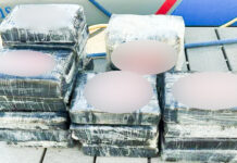 a pile of ice cubes sitting on top of a wooden dock