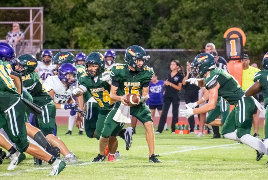 a group of young men playing a game of football