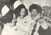 a group of women standing around each other