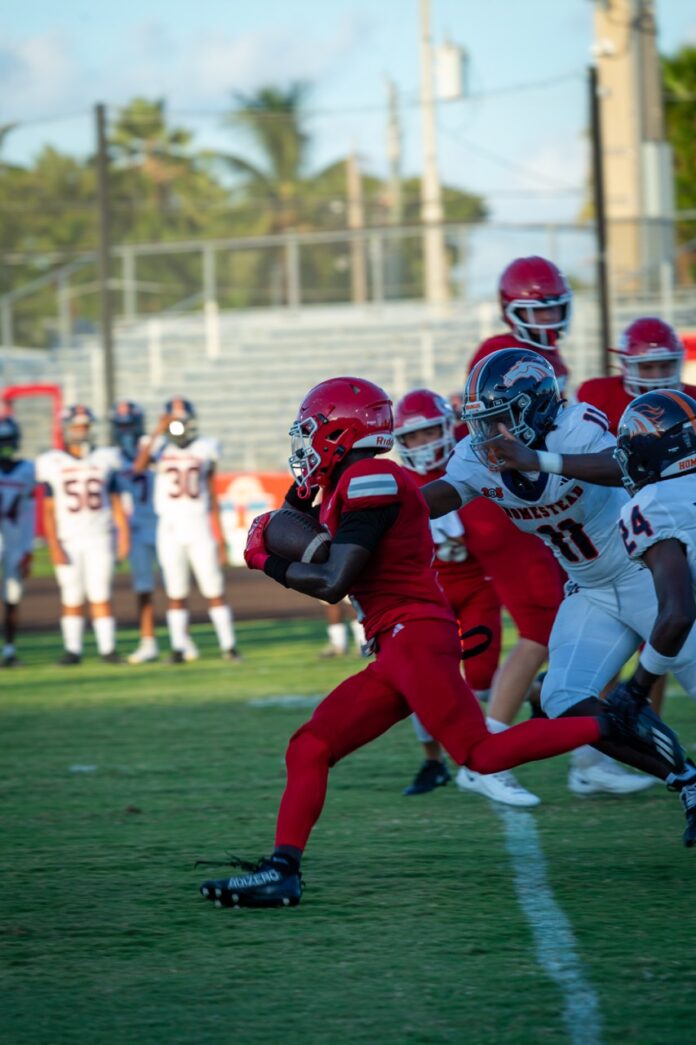 a football game is being played on a sunny day