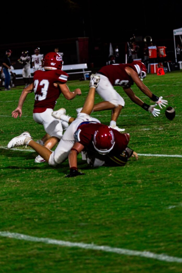 a group of young men playing a game of football