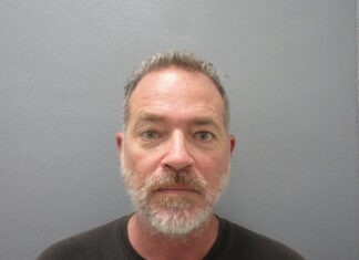 a man with a beard and a black shirt