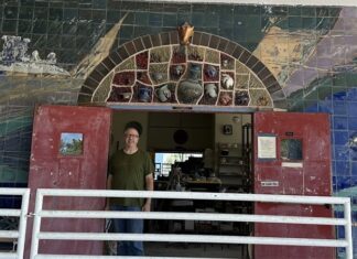 a man standing in a doorway of a building