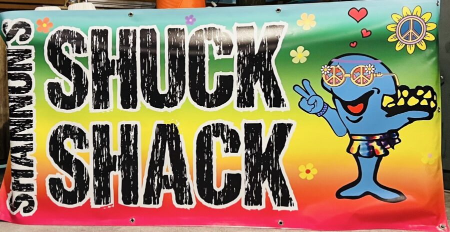 a sign that says shock shack with an image of a cartoon character