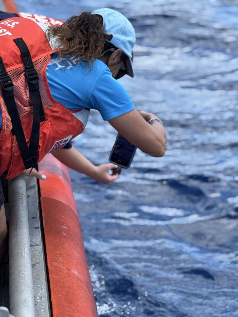 two people on a boat in the water