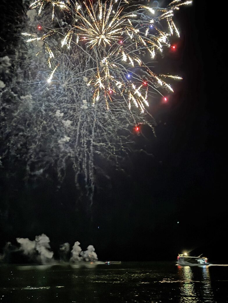 a large fireworks display over a body of water
