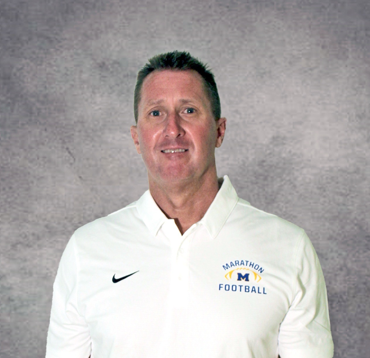 a man in a white shirt is posing for a picture
