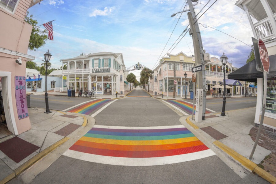 a rainbow painted street in a small town