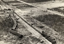 a black and white photo of a train on tracks
