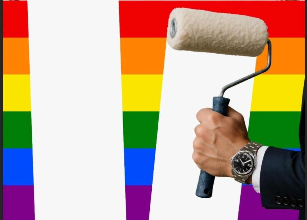 a hand holding a paint roller with a rainbow background