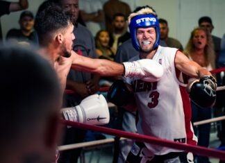 a man in a boxing ring with a punching glove