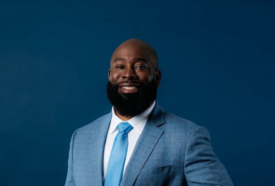 a man in a suit and tie posing for a picture