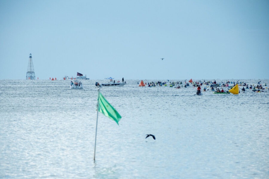 a large body of water with a flag in the middle of it