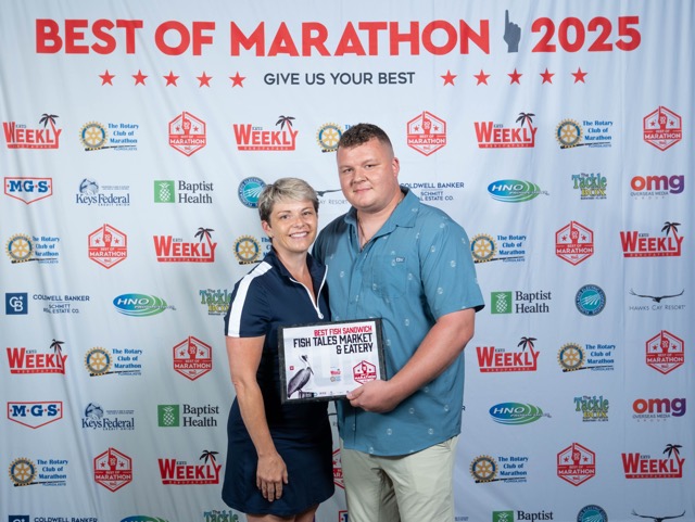 a man and a woman posing for a picture