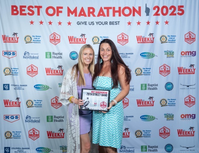 a couple of women standing next to each other