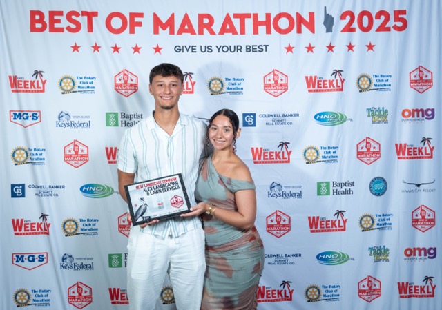 a man and a woman posing for a picture