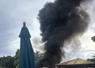 BOAT GOES ABLAZE IN KEY LARGO; NO INJURIES REPORTED a large black cloud of smoke billows from a building