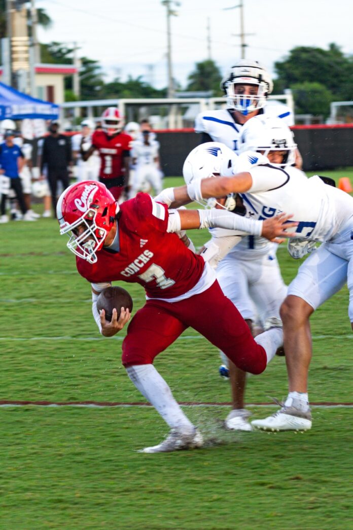 a football player running with the ball during a game
