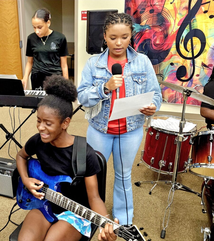 a group of people playing instruments in a room