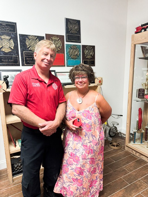 a man and a woman standing in a room