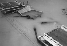 a black and white photo of a boat in the water