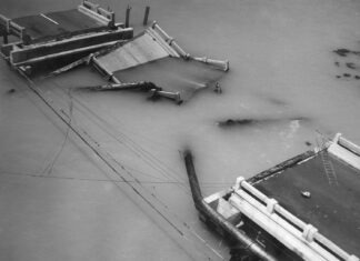 a black and white photo of a boat in the water