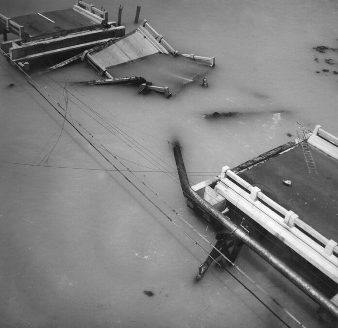 a black and white photo of a boat in the water