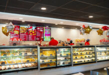 a deli with a lot of food inside of it
