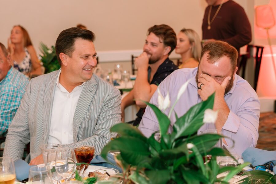 a group of people sitting around a table