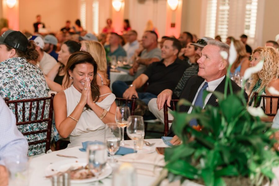 a group of people sitting at tables in a room