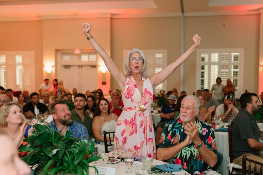 a woman standing in front of a crowd of people
