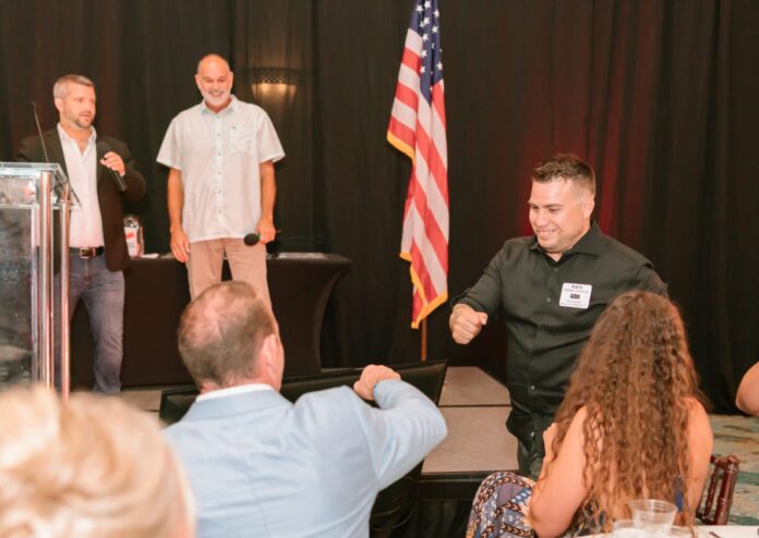 BOM 2025 a group of people sitting around a table