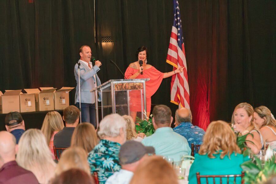 a couple of people that are standing on a stage