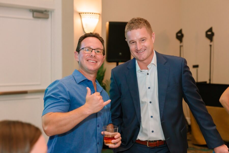 a couple of men standing next to each other