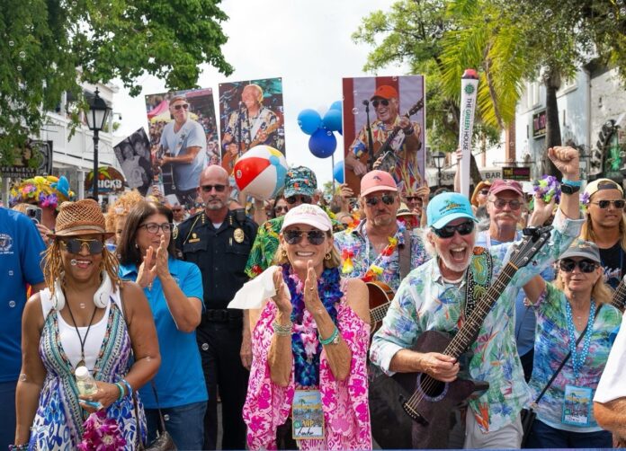 Buffett March leaders by Nick Large a group of people standing next to each other