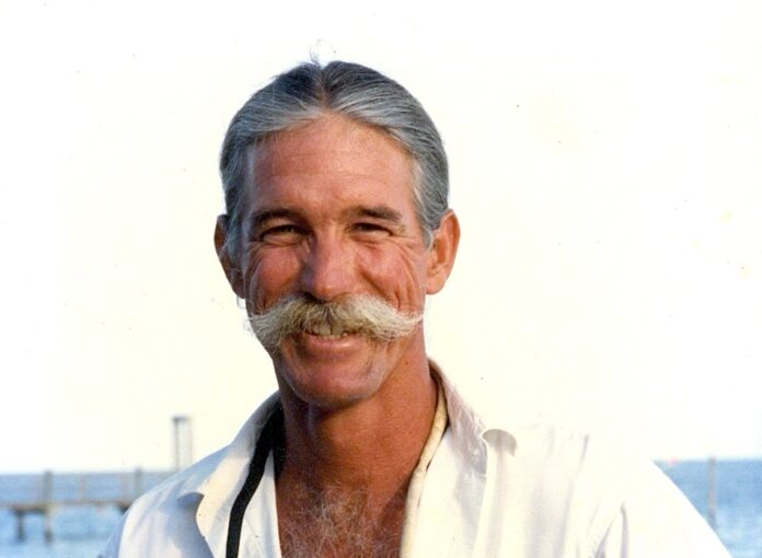 Chris water a man with a mustache and a white shirt