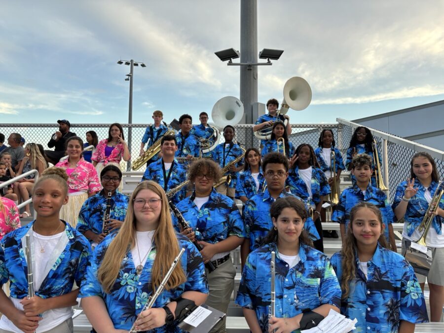 a group of young people wearing blue shirts