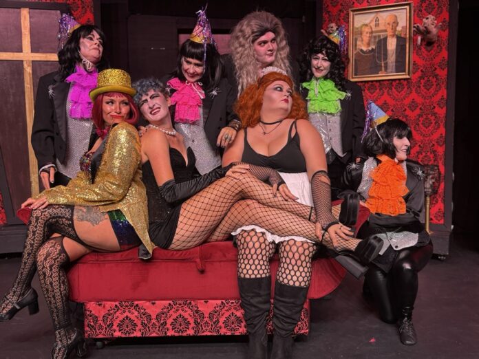 a group of women dressed in costumes sitting on a couch