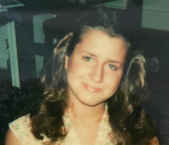 a young woman is posing for a picture