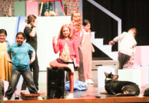 a group of people standing on top of a stage