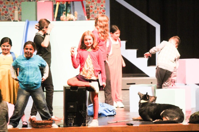 a group of people standing on top of a stage