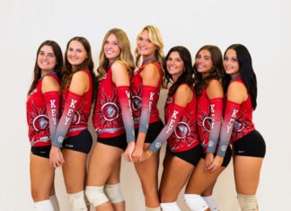 a group of beautiful women standing next to each other