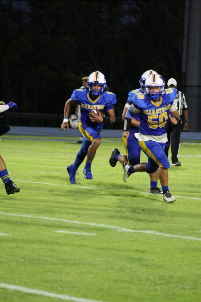 a group of people playing a game of football