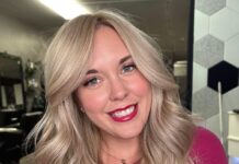 a woman with blonde hair and a pink shirt