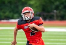 a football player is running with the ball