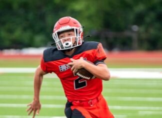 a football player is running with the ball