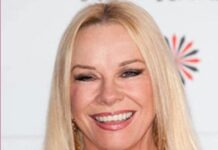 a woman with blonde hair smiling at the camera