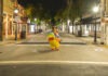 a person in a costume walking down a street